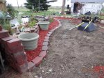 Flower beds mulched, dirt leveled.JPG