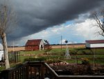 Same clouds looking out to back yard in sunshine.JPG