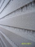 Rows of ice on house siding.JPG