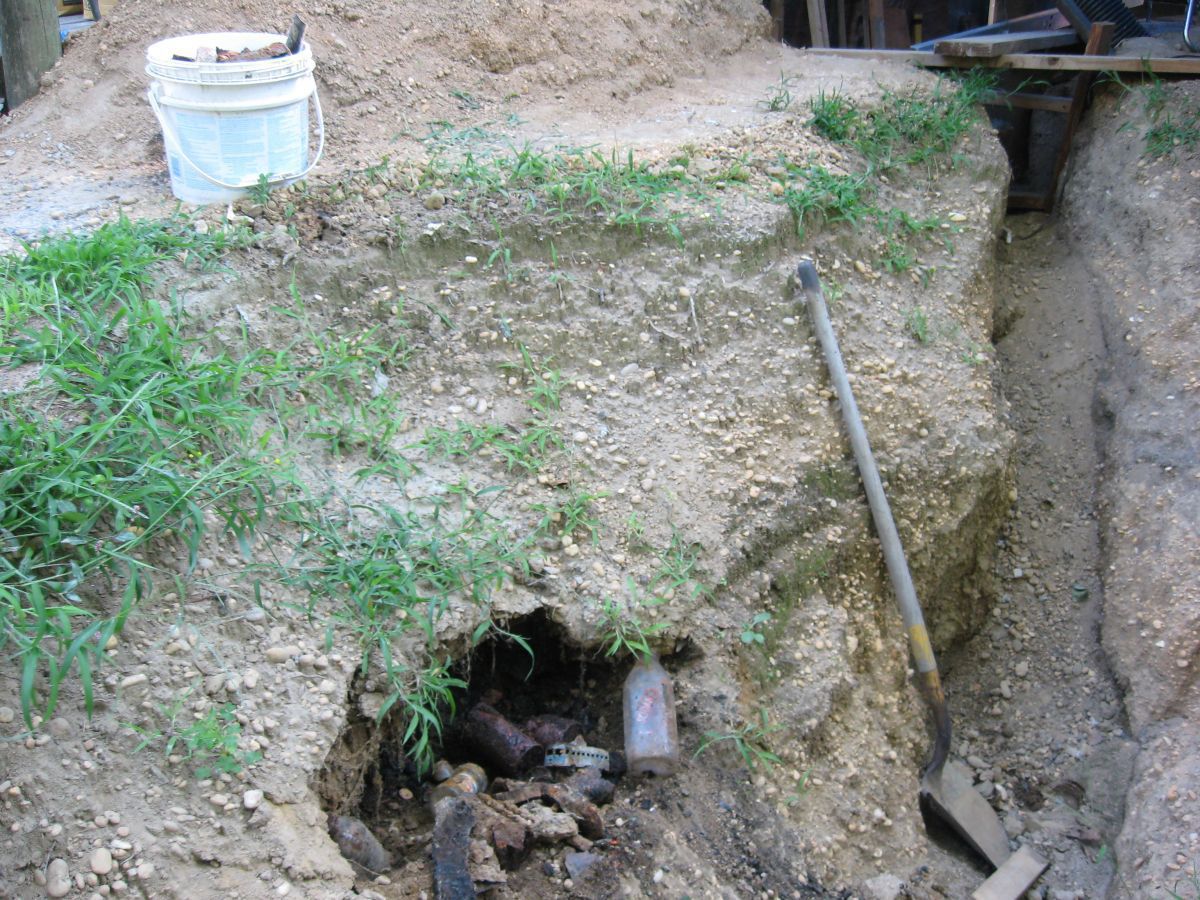 The previous home owner apparently burned And burried their garbage